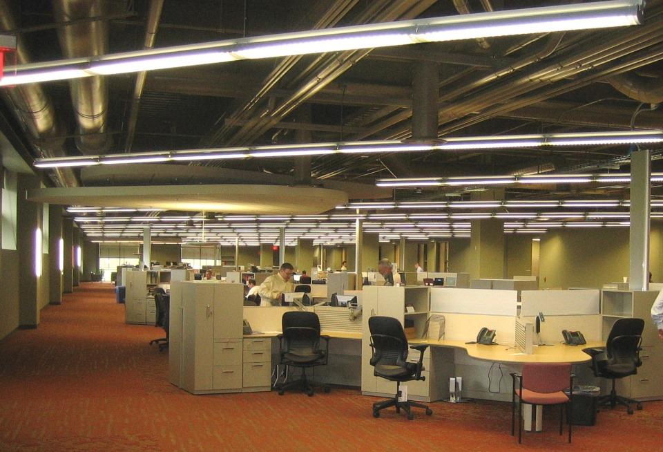 The open office area is a loft like environment with exposed mechanical and electrical infrastructure